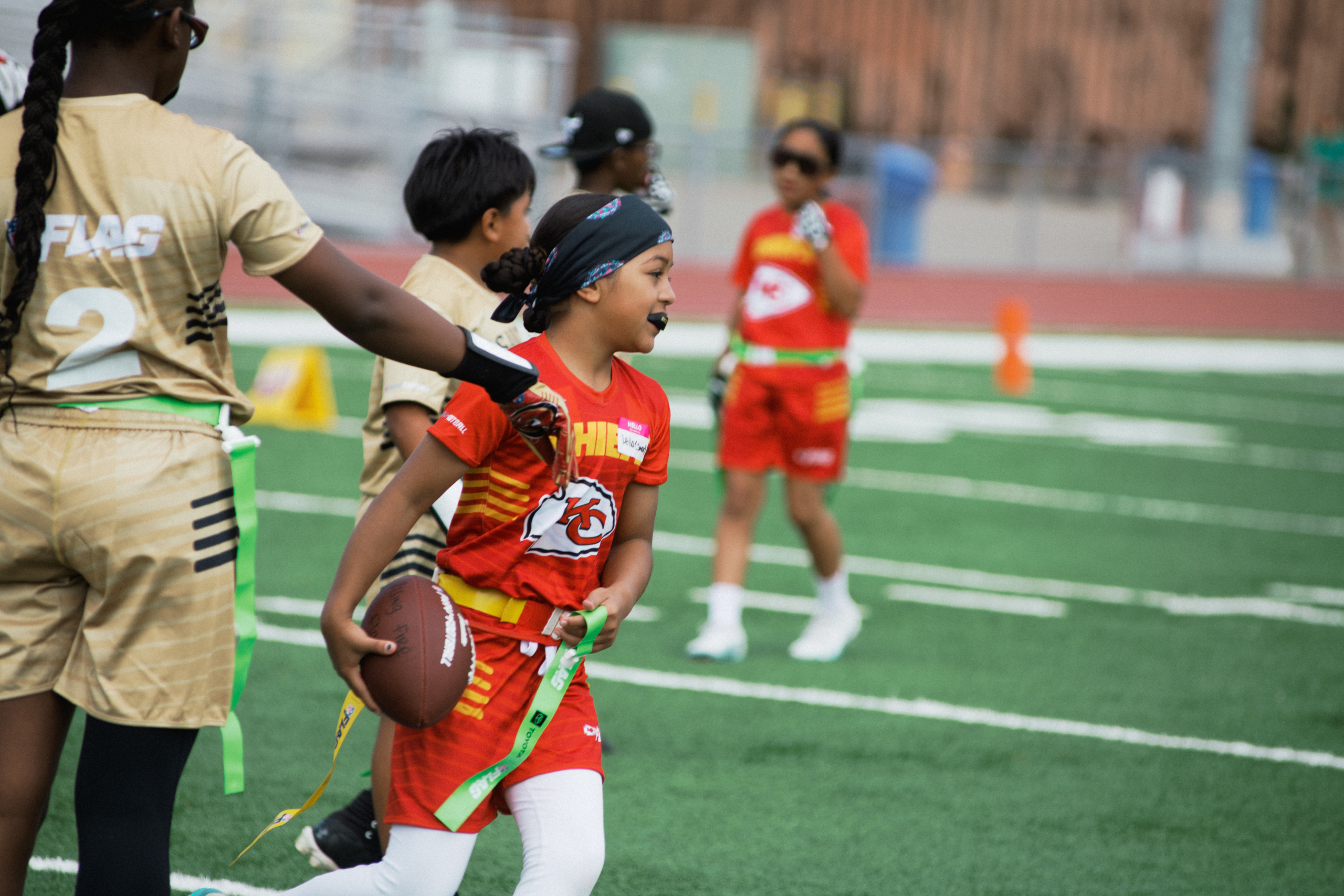 Female flag football players in action